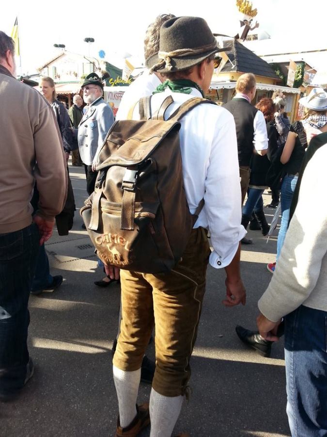 Man wearing traditional outfit - and backpack!